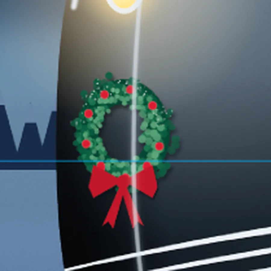 A close-up of the wreath with red berries round it, a red bow with notched tails underneath and a dusting of snow on top
