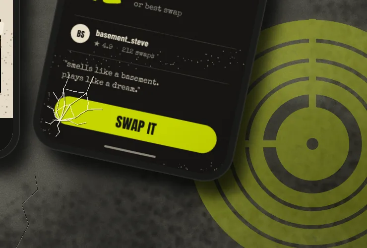 A close-up of the tilted phone's bottom-left corner, with a fine spiderweb crack spreading from the corner over the SWAP IT button, and a large chartreuse stencilled record sprayed on the wall behind the phone