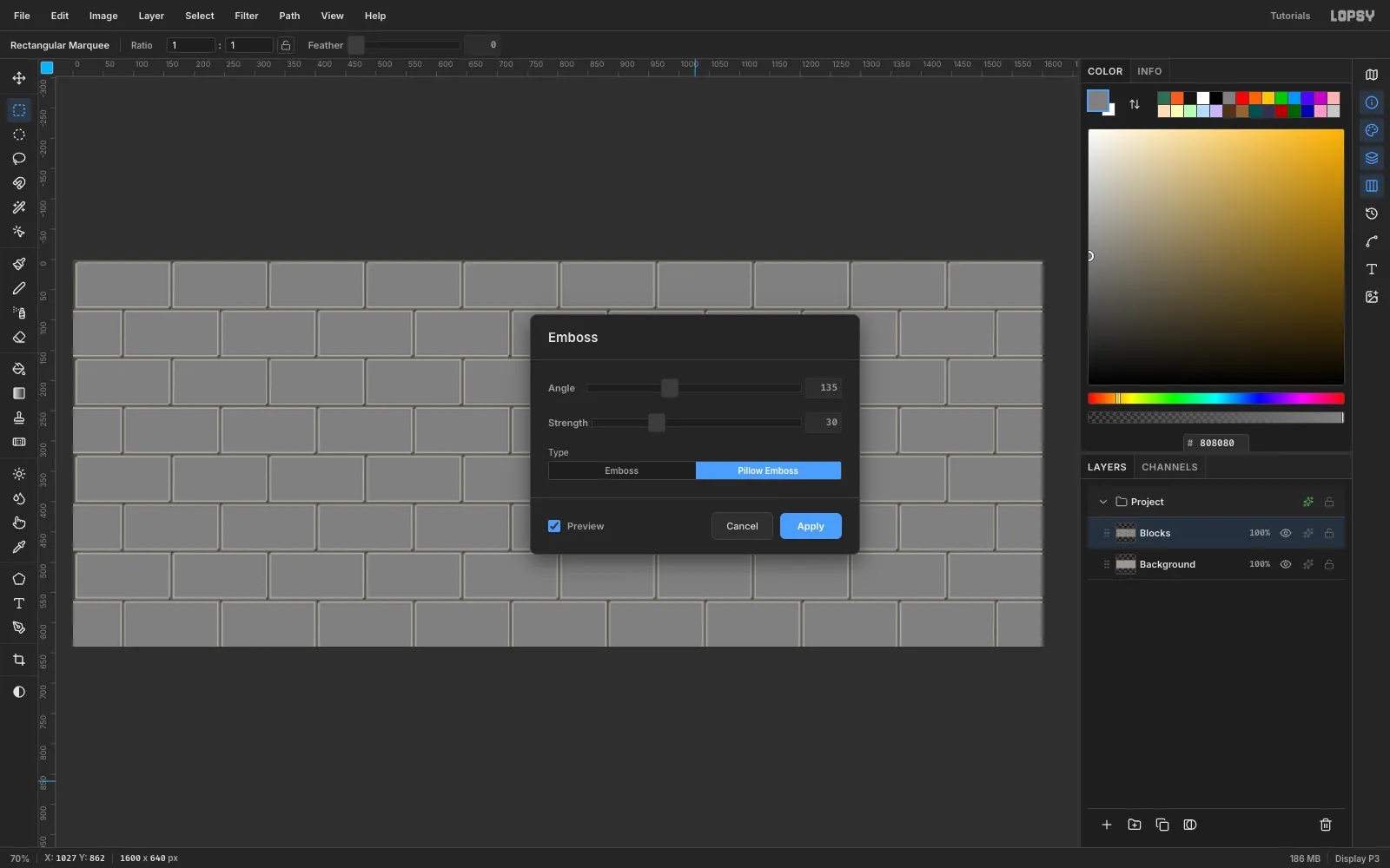 The Emboss dialog set to Angle 135, Strength 30 and Pillow Emboss, turning the blocks into raised grey slabs