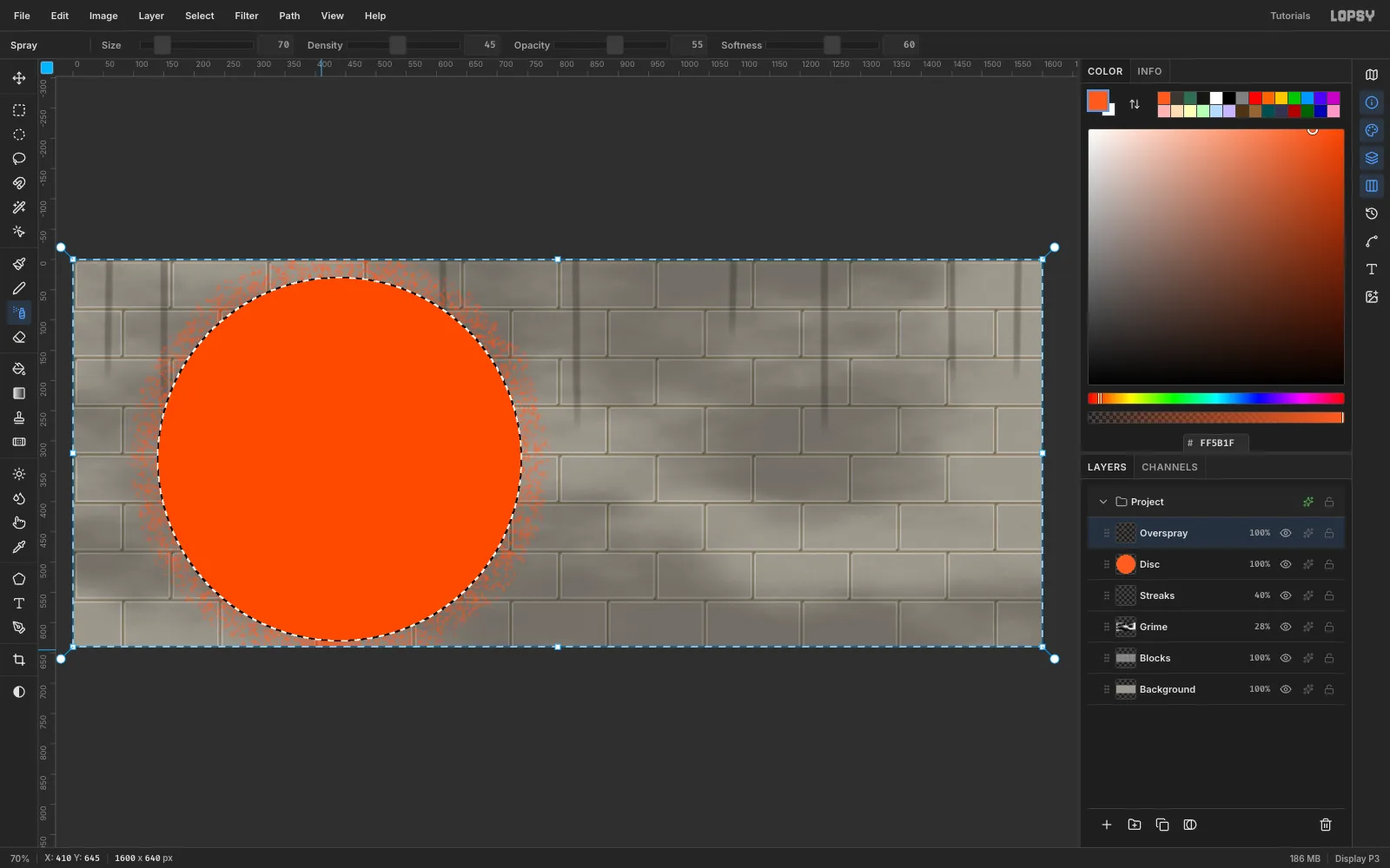 The orange disc with a speckled halo of orange spray dots just outside its edge, with the inverse selection active