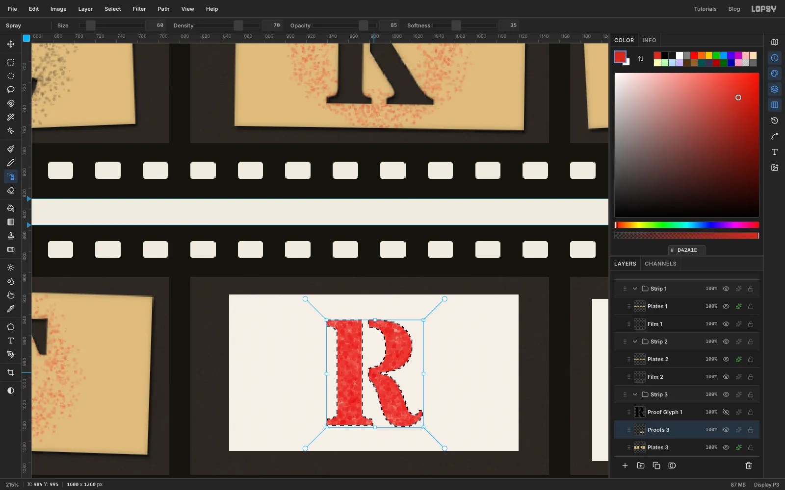 Close-up of a white card in frame 11 with a red R being sprayed inside a letter-shaped selection